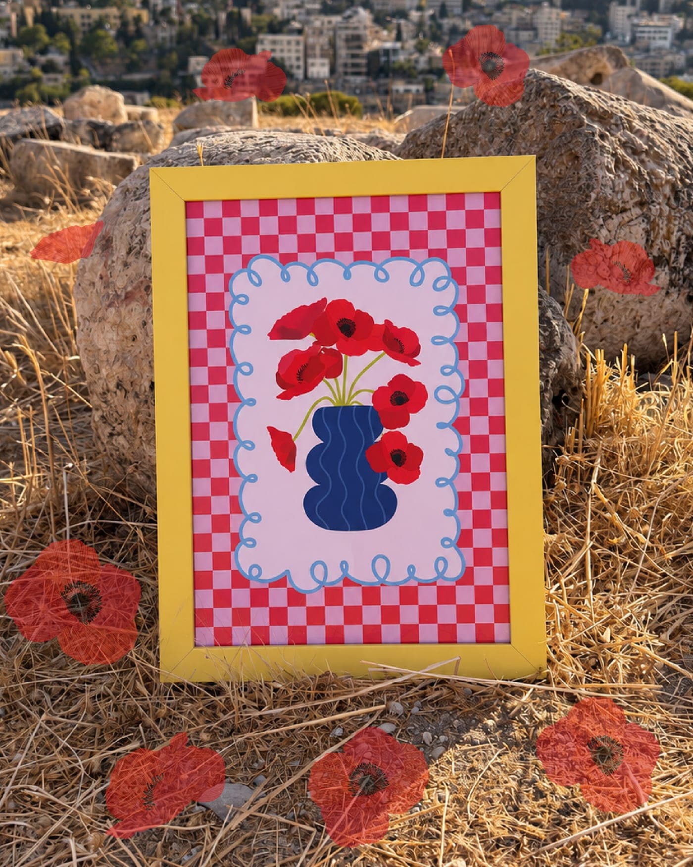 Dahnon print in a yellow frame leaning on a rock among dry grass