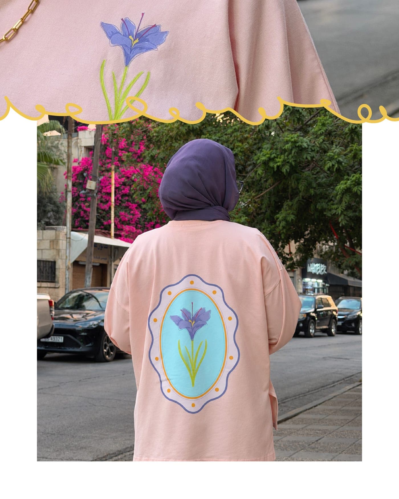 Back of a peach pink oversized tee printed with the Iris mirror, worn on a street in Amman